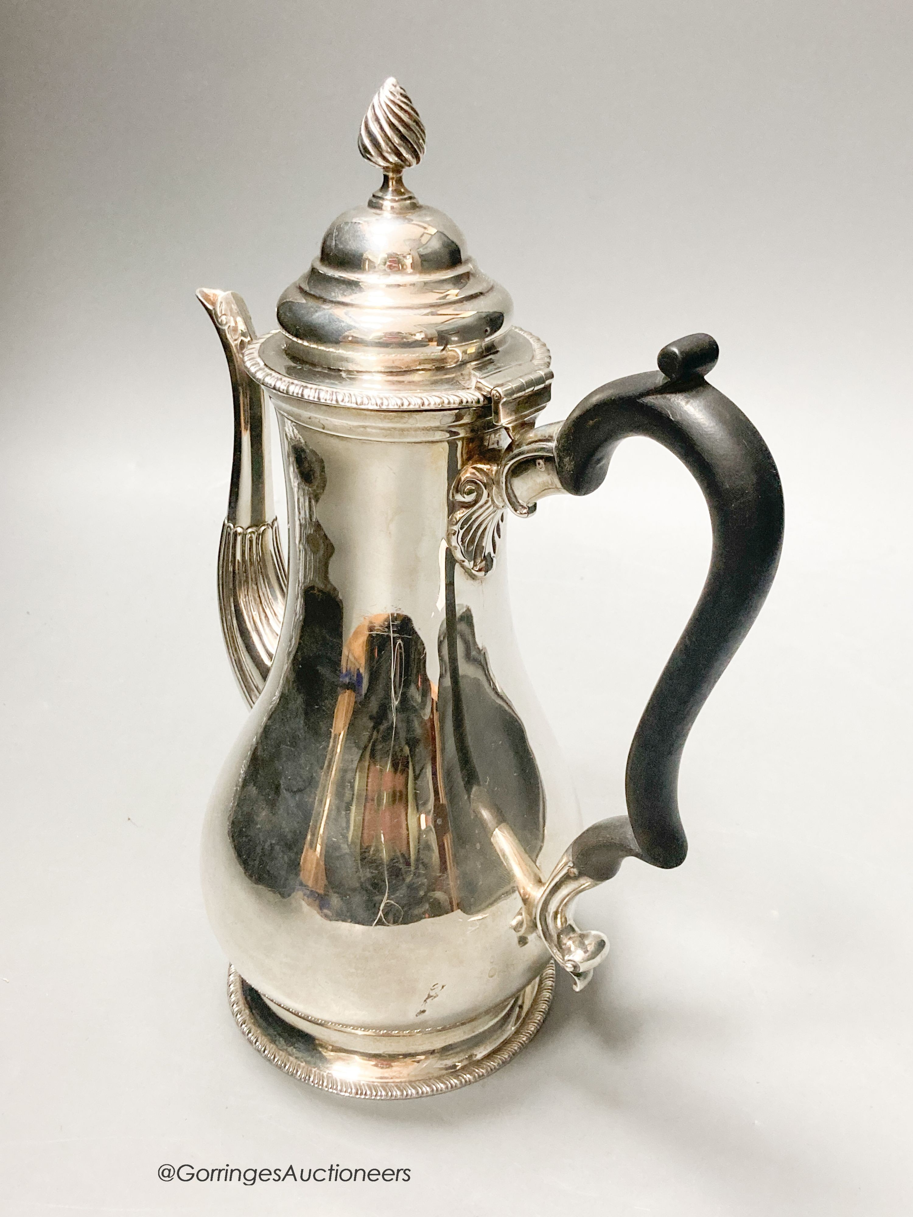 A George V silver baluster coffee pot, Carrington & Co, London, 1927, height 26cm, 20.5oz.